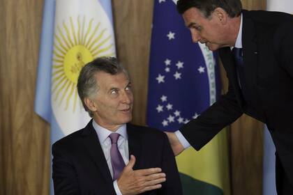 Brazils President Jair Bolsonaro, right, talks with Argentinas President Mauricio Macri during a meeting at Planalto presidential palace in Brasilia, Brazil, Wednesday, Jan. 16, 2019. Macri is a one-day visit to Brazil.