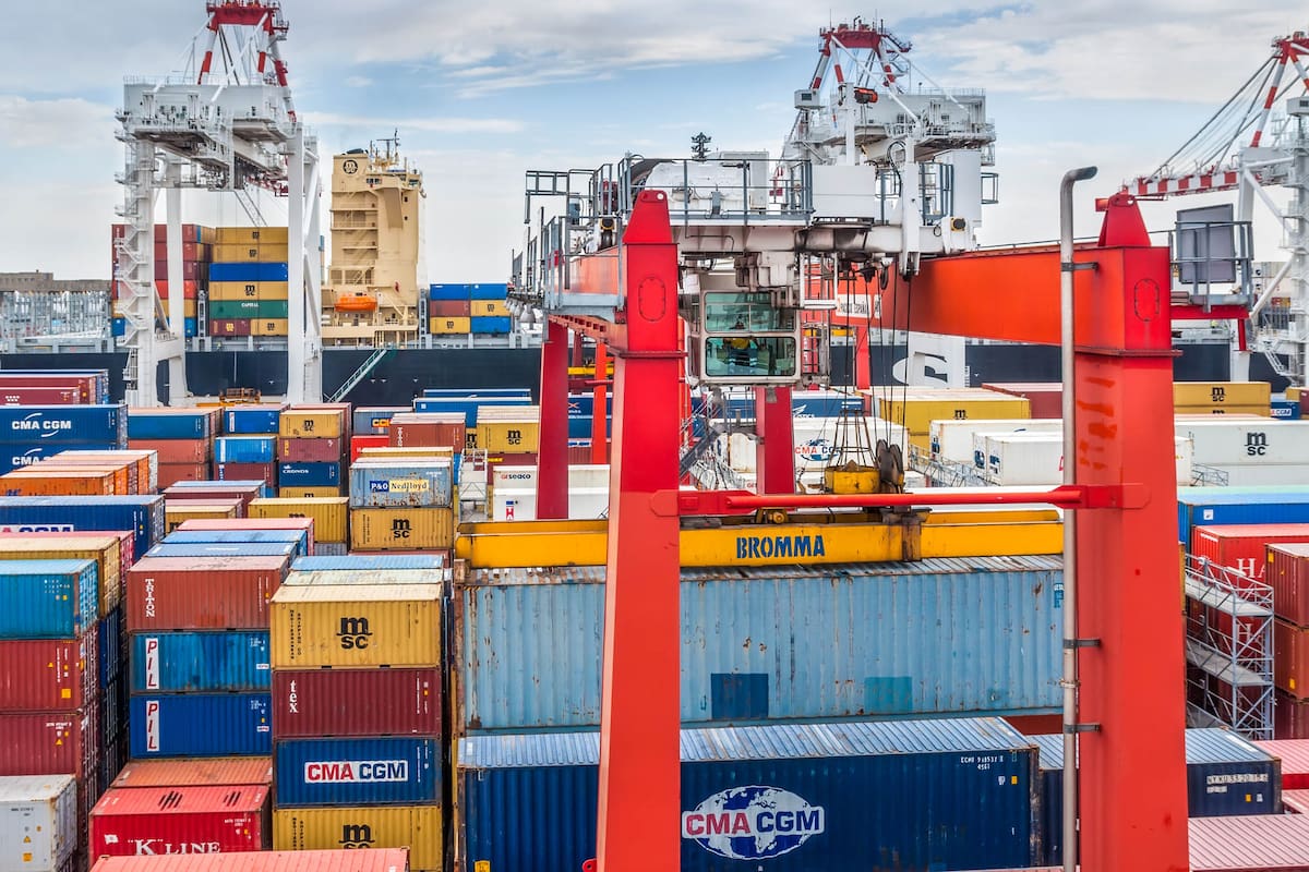 BUENOS AIRES, ARGENTINA - DECEMBER 17, 2012: Containers operation in the Port of Buenos Aires, Argentina. The Port of Buenos Aires is the principal maritime port in Argentina.