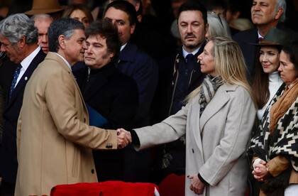 Buenos Aires City Mayor Jorge Macri (L) greets Argentina's Secretary General of the Presidency Karina Milei during the Argentine Rural Society's expo in Buenos Aires on July 26, 2025. (Photo by AFP)
