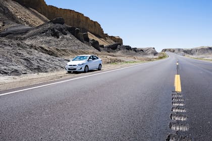 Caneville, Utah, USA - April 21, 2017: Car stopped in Utah desert along the scenic state route 24
