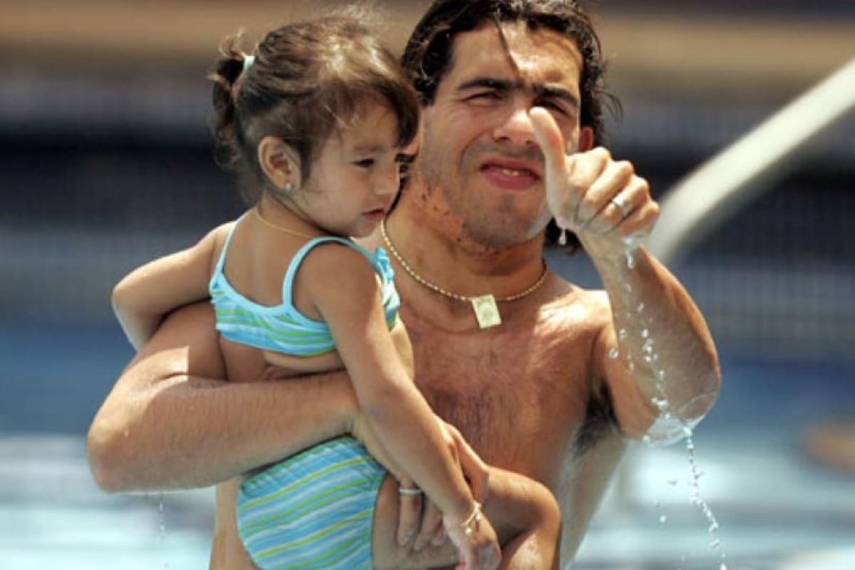 Carlitos Tévez junto a su hija Florencia.