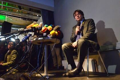 Catalonias ousted leader Carles Puigdemont attends a press conference on April 7, 2018 in Berlin after judges refused his extradition to Spain on a rebellion charge and ordered him freed on bail pending a ruling on a lesser corruption charge. A German court on April 5, 2018 refused a request from Sp