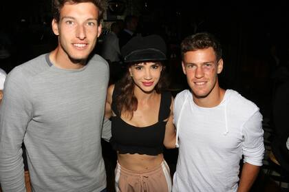 Celeste Cid junto a los tenistas Pablo Carreño Busta y Diego Schwartzman
