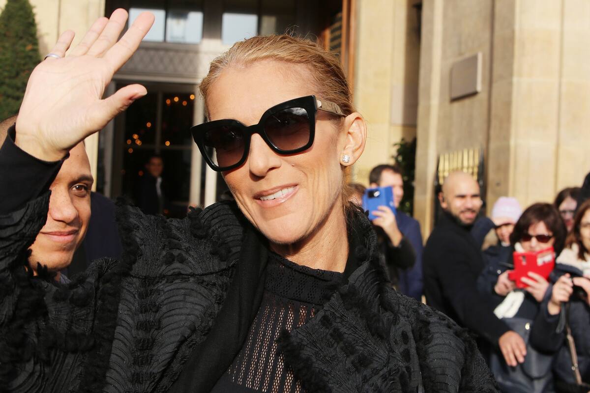 Celine Dion greets fans outside the Crillon Hotel