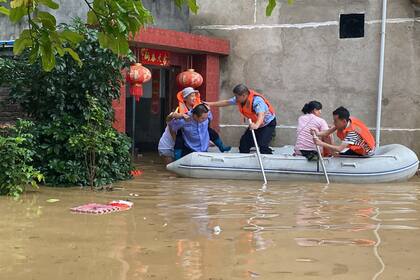 China; tormentas; evacuados; MUndo