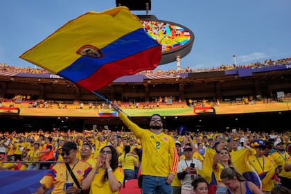 Colombia soccer fans cheer from the stands ahead the World Cup round of 32 soccer match between Colombia and Ghana in Kansas City, Mo., Friday, July 3, 2026. (AP Photo/John Locher)