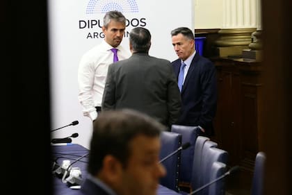Martín Menem, Germán Martínez y Bornoroni, antes de la sesión