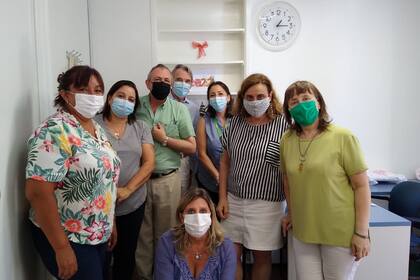 Con sus compañeros de trabajo.