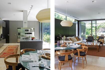 Concebida como un espacio de varios usos, la cocina tiene un área de trabajo con amoblamiento laqueado y en acero inoxidable y una isla con mesada de Neolith (Artecnia) y campana de techo (Smeg).