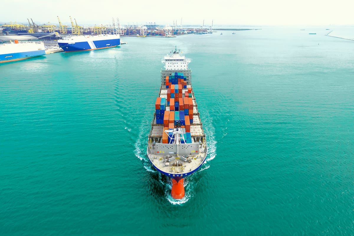 container ship being shipping out of stock port by sea, thailand.