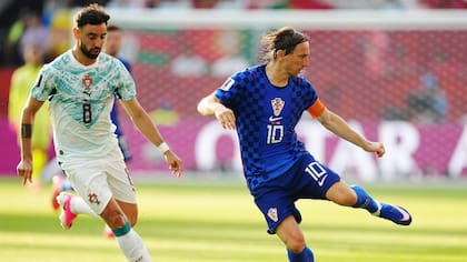 Croatia's Luka Modric (10) controls the ball in front of Portugal's Bruno Fernandes (8) during the World Cup round of 32 soccer match between Portugal and Croatia in Toronto, Thursday, July 2, 2026. (Nathan Denette/The Canadian Press via AP)