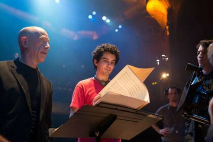 Damien Chazelle en el set de Whiplash, junto a J.K. Simmons y Miles Teller
