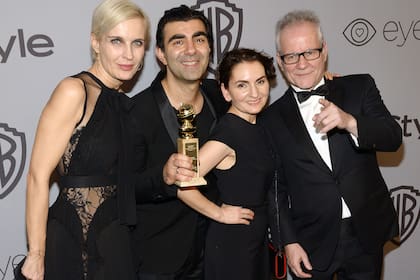 Director of "Into The Fade" Fatih Akin (2L) and guests attend the 19th Annual InStyle And Warner Bros. Pictures Golden Globe After-Party on January 7, 2018, in Beverly Hills, California. / AFP PHOTO / Tara Ziemba