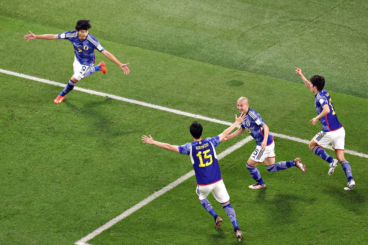 DOHA, QATAR - DECEMBER 01: Ao Tanaka of Japan celebrates after scoring the team's second goal during the FIFA World Cup Qatar 2022 Group E match between Japan and Spain at Khalifa International Stadium on December 01, 2022 in Doha, Qatar. (Photo by Elsa/Getty Images)
