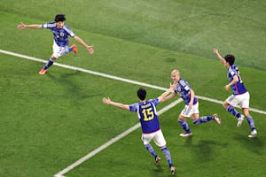 DOHA, QATAR - DECEMBER 01: Ao Tanaka of Japan celebrates after scoring the team's second goal during the FIFA World Cup Qatar 2022 Group E match between Japan and Spain at Khalifa International Stadium on December 01, 2022 in Doha, Qatar. (Photo by Elsa/Getty Images)
