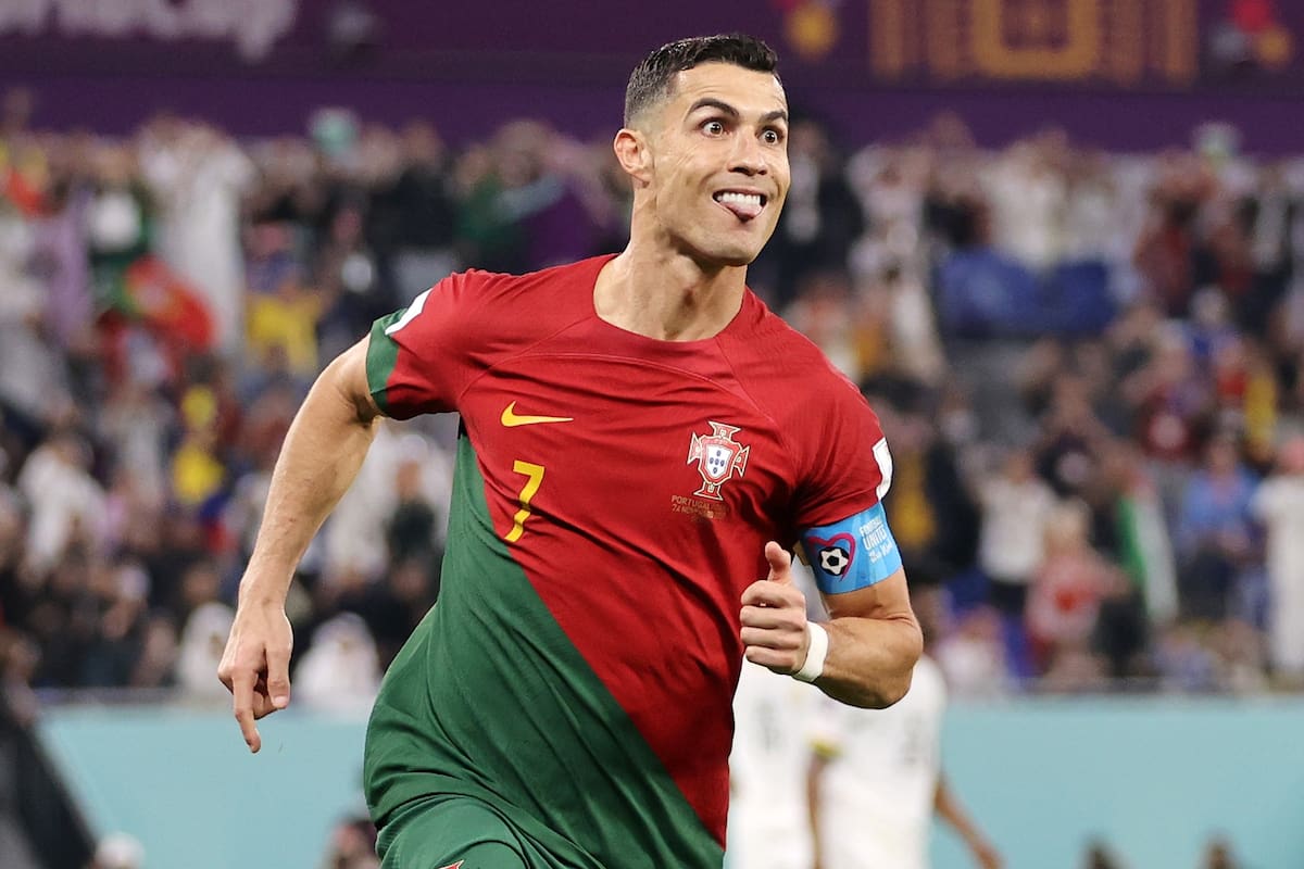 DOHA, QATAR - NOVEMBER 24: Cristiano Ronaldo of Portugal celebrates with Joao Felix after scoring their team's first goal via a penalty during the FIFA World Cup Qatar 2022 Group H match between Portugal and Ghana at Stadium 974 on November 24, 2022 in Doha, Qatar. (Photo by Clive Brunskill/Getty Images)