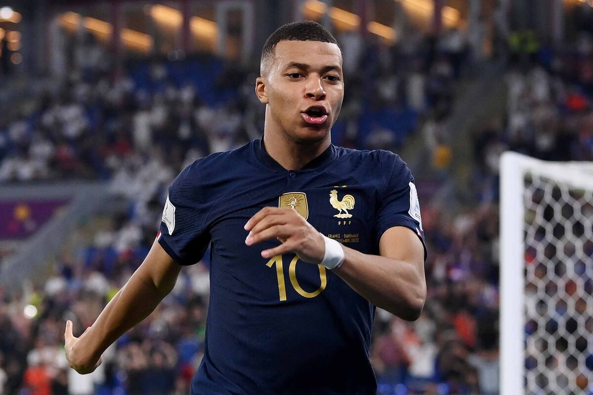 DOHA, QATAR - NOVEMBER 26: Kylian Mbappe of France celebrates after scoring their team's second goal during the FIFA World Cup Qatar 2022 Group D match between France and Denmark at Stadium 974 on November 26, 2022 in Doha, Qatar. (Photo by Stu Forster/Getty Images)