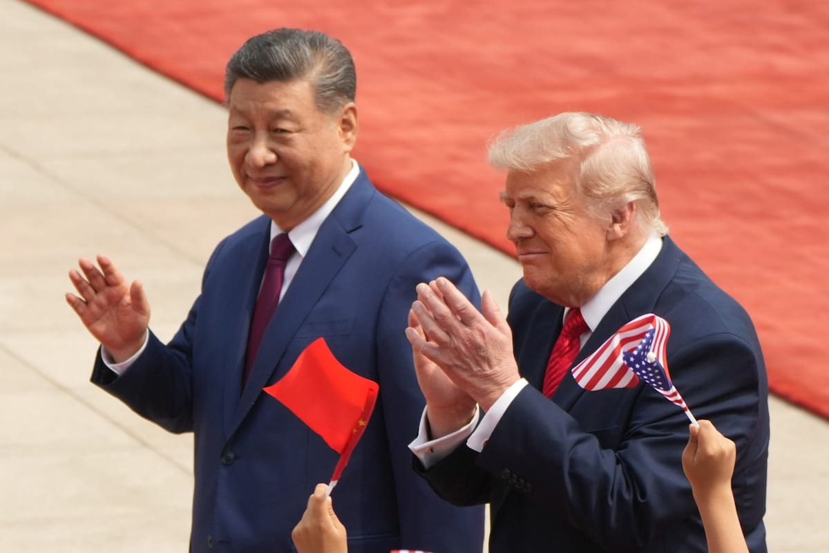 Donald Trump junto a Xi Jinping