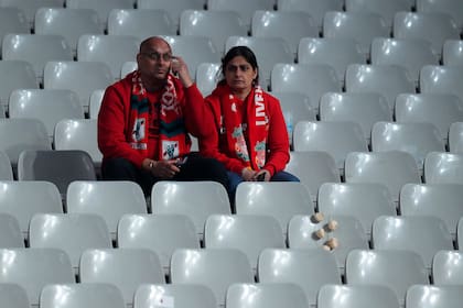 Dos hinchas de Liverpool, golpeados por la derrota