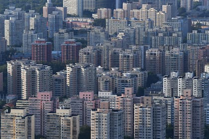Edificios residenciales en Pekín (Photo by GREG BAKER / AFP)