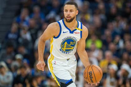 El armador de los Warriors de Golden State, Stephen Curry (30) conduce durante la primera mitad del juego de baloncesto de la NBA ante los Clippers de Los Ángeles, en San Francisco, el domingo 27 de octubre de 2024. (AP Foto/Nic Coury)
