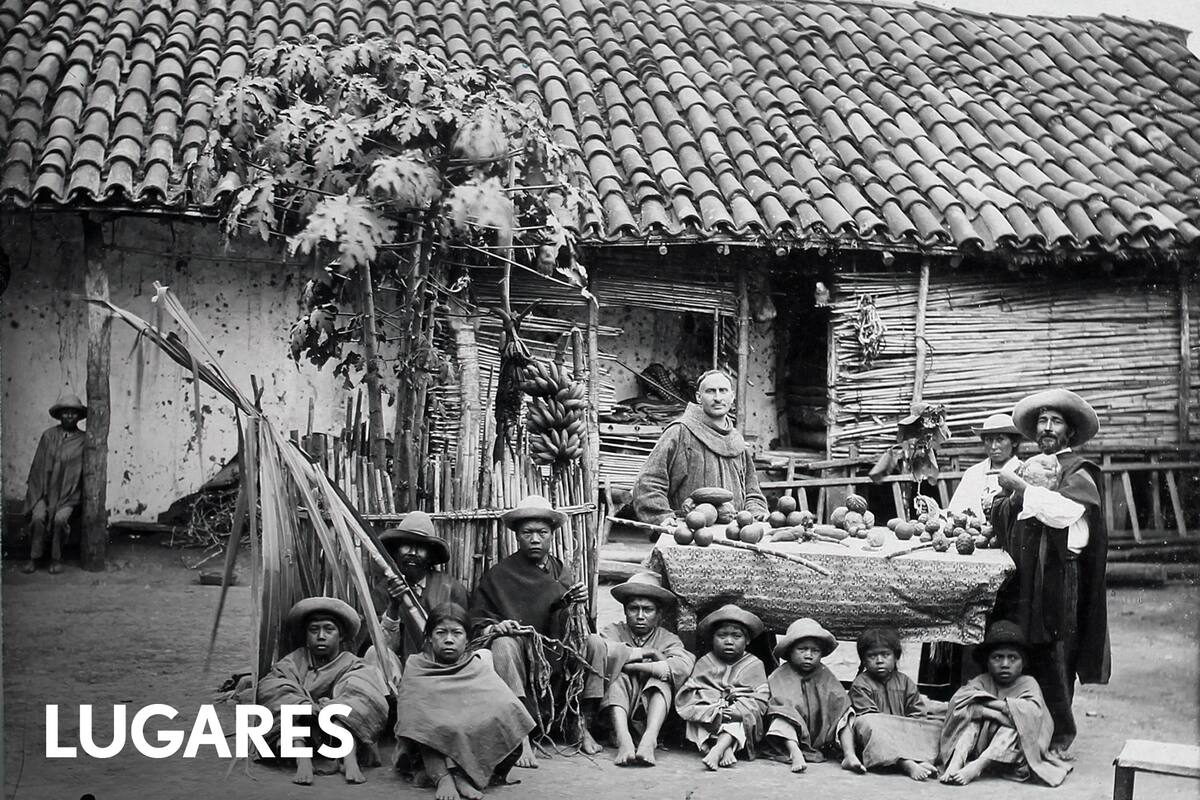 El capataz de Chimeo le muestra al padre franciscano la variedad de frutas que produce esa misión.