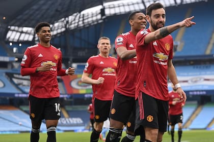 El festejo de todo Manchester United, que venció al City de visitante
