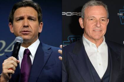 El gobernador de Florida, Ron DeSantis, (izquierda) y el CEO de Disney, Bob Iger