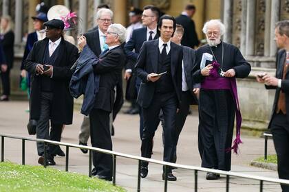 El músico Nick Cave y el arzobispo de Canterbury, Rowan Williams, llegaron juntos a la abadía.