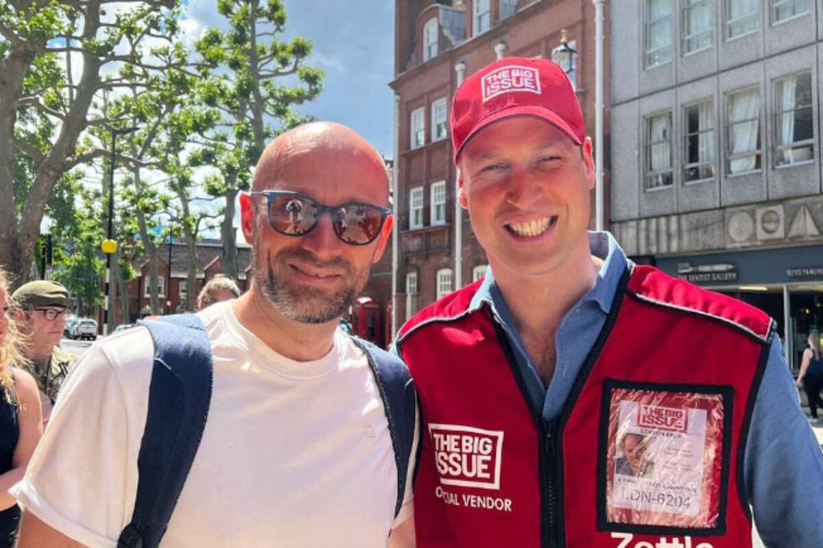 El turista lituano Vitalijus Zuikauskas con el príncipe Guillermo