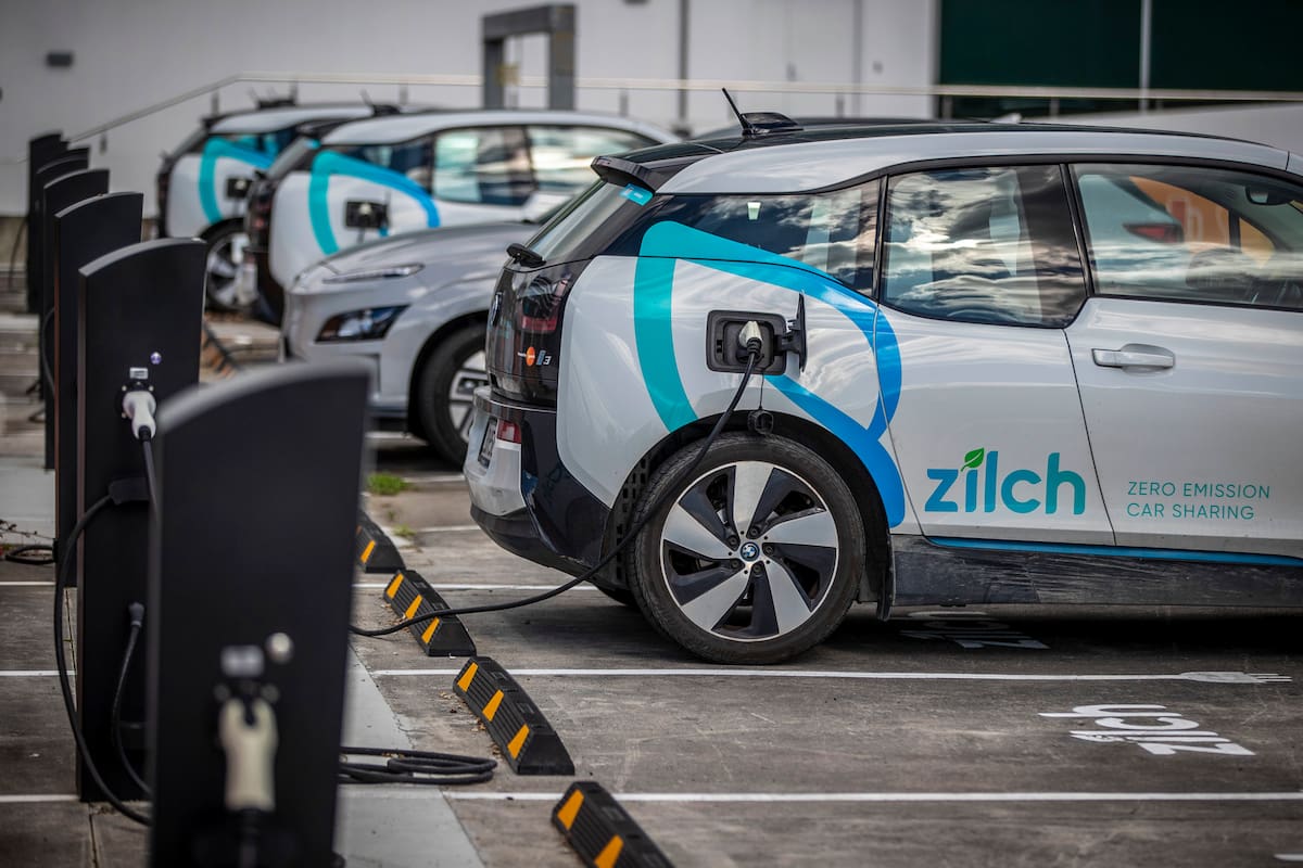 Electric vehicle charging station and car share parking are seen in Auckland, New Zealand, on Aug. 12, 2021. New Zealand will help pay for lower-income families to scrap their old gas guzzlers and replace them with cleaner hybrid or electric cars as part of a sweeping plan to reduce greenhouse gas emissions the government announced Monday May 16, 2022. (Michael Craig/ NZ Herald photograph via AP)
