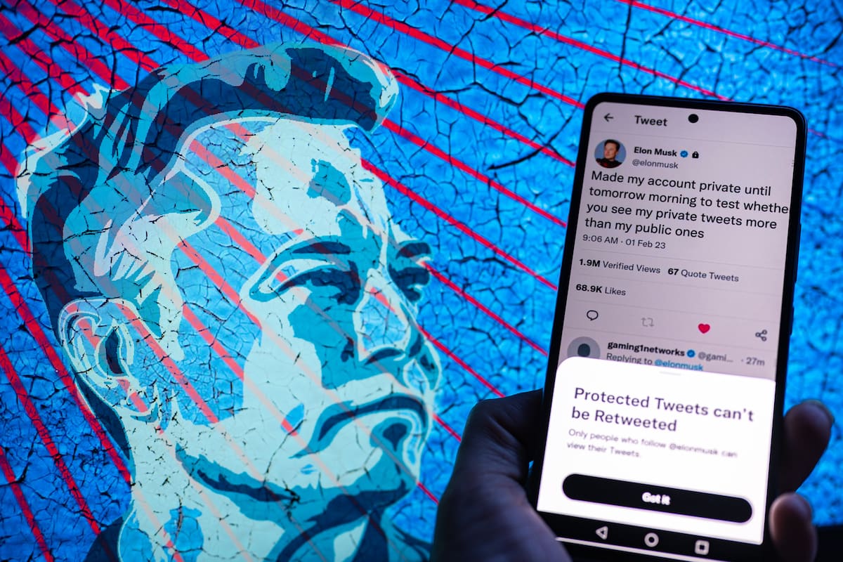 Elon Musk Twitter account private page seen on Mobile with Elon Musk in the background on screen. On 2 February 2023 in Brussels, Belgium. J (Photo Illustration by Jonathan Raa/NurPhoto via Getty Images)