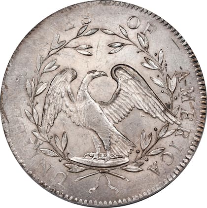 En el reverso se observa un águila calva posada sobre una rama y rodeada por una corona de olivo junto con la leyenda "UNITED STATES OF AMERICA"
