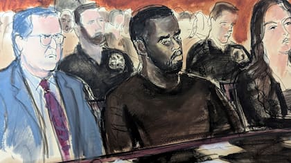 En este boceto de la sala del tribunal, Sean Combs, en el centro, está flanqueado por sus abogados defensores