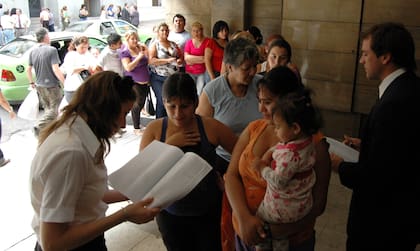 Entrega de planes en 2009, una postal que nunca se dejó de replicar