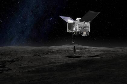 Esta representación artística, proporcionada por la NASA el 6 de septiembre de 2016, muestra a la nave espacial OSIRIS-REx tomando muestras del asteroide Bennu. (NASA/Centro Goddard de vuelos espaciales vía AP, archivo)