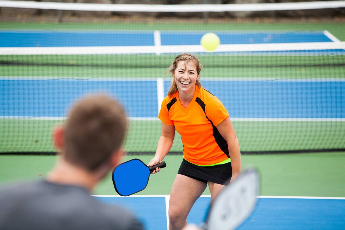 Female Pickleball player on the court.