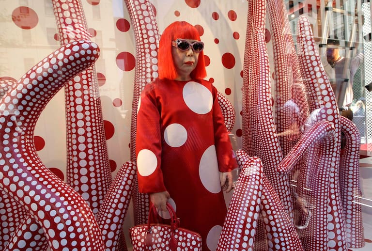 FILE - A wax model of Japanese artist Yayoi Kusama is displayed in the windows of Louis Vuitton's flagship Fifth Avenue store in New York, Tuesday, July 10, 2012. (AP Photo/Kathy Willens, File)