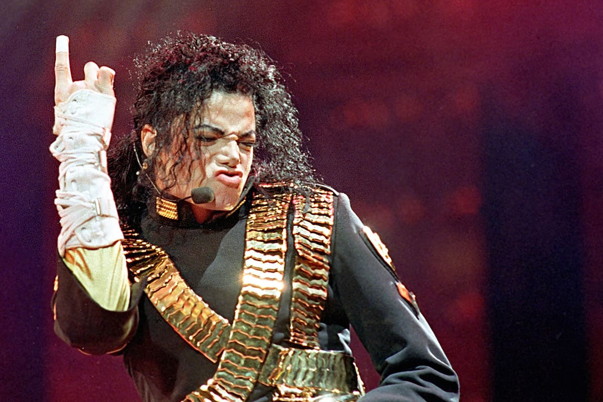 FILE - In this Aug. 25, 1993 file photo, American pop star Michael Jackson performs during his "Dangerous" tour in Bangkok. (AP Photo/Jeff Widerner, file)