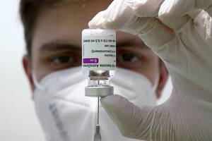 FILE - In this file photo dated Monday, March 22, 2021, medical staff prepares a syringe from a vial of the AstraZeneca coronavirus vaccine during preparations at the vaccine center in Ebersberg near Munich, Germany. Berlin√¢ˇÊ¨‚Ñ¢s top health official said Tuesday March 30, 2021, that the German state of Berlin is again suspending the use of AstraZeneca√¢ˇÊ¨‚Ñ¢s coronavirus vaccine for people under 60 as a precaution, due to reports of blood clots. (AP Photo/Matthias Schrader, FILE)