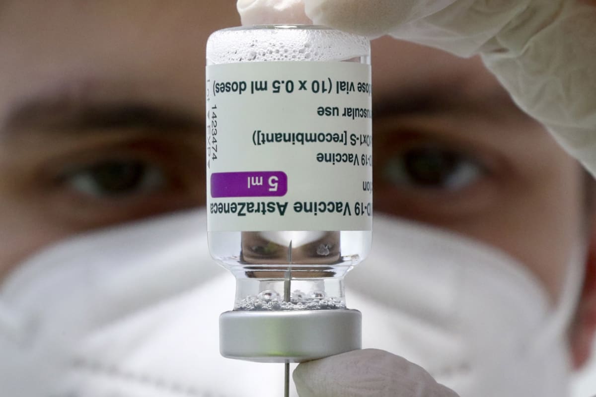 FILE - In this file photo dated Monday, March 22, 2021, medical staff prepares a syringe from a vial of the AstraZeneca coronavirus vaccine during preparations at the vaccine center in Ebersberg near Munich, Germany. Berlin√¢ˇÊ¨‚Ñ¢s top health official said Tuesday March 30, 2021, that the German state of Berlin is again suspending the use of AstraZeneca√¢ˇÊ¨‚Ñ¢s coronavirus vaccine for people under 60 as a precaution, due to reports of blood clots. (AP Photo/Matthias Schrader, FILE)