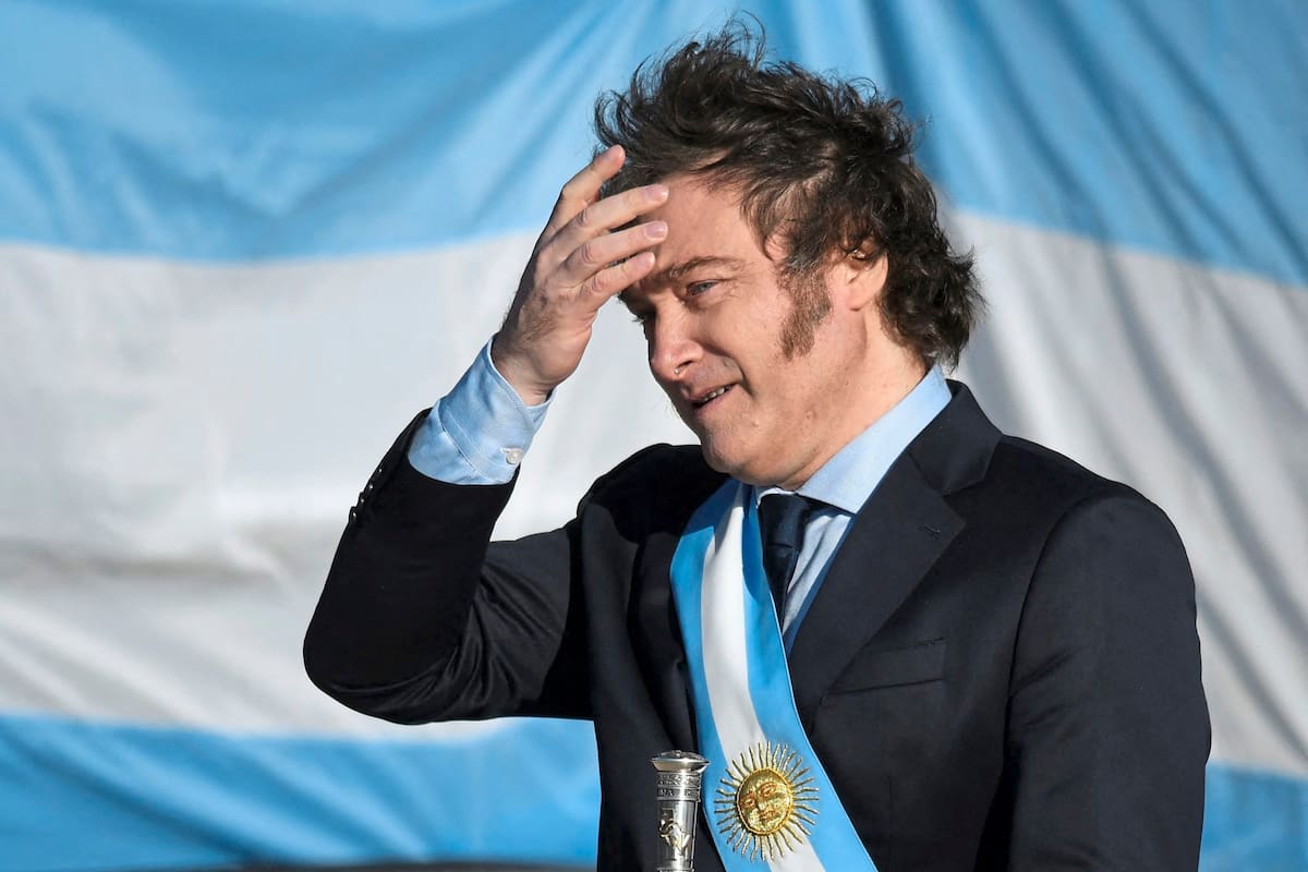 (FILES) Argentina's President Javier Milei gestures during the Flag Day commemoration at the National Flag Memorial in Rosario, Santa Fe, Argentina on June 20, 2024. Argentina's President Javier Milei announced on June 30, 2025, that the South American country will appeal a US judge's ruling ordering it to hand over 51% of the shares of state-owned oil company YPF to partially pay two companies affected by its nationalization. (Photo by AFP)