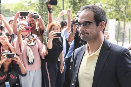 (FILES) In this file photo taken on July 03, 2018, former Malaysian prime minister Najib Razaks stepson Riza Aziz arrives to give a statement at the Malaysian Anti-Corruption Commission headquarters in Putrajaya, outside Kuala Lumpur. - The Malaysian producer of the Leonardo DiCaprio-starred film &a