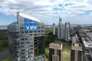 (FILES) The logo of the Argentine national oil company YPF is seen on the company's headquarters in Buenos Aires on July 28, 2023. A New York Court of Appeals overturned on March 27, 2026 the ruling that ordered Argentina to pay $16.1 billion in compensation for the 2012 nationalisation of the oil company YPF, according to the ruling seen by AFP. (Photo by Luis ROBAYO / AFP)