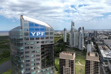 (FILES) The logo of the Argentine national oil company YPF is seen on the company's headquarters in Buenos Aires on July 28, 2023. A New York Court of Appeals overturned on March 27, 2026 the ruling that ordered Argentina to pay $16.1 billion in compensation for the 2012 nationalisation of the oil company YPF, according to the ruling seen by AFP. (Photo by Luis ROBAYO / AFP)