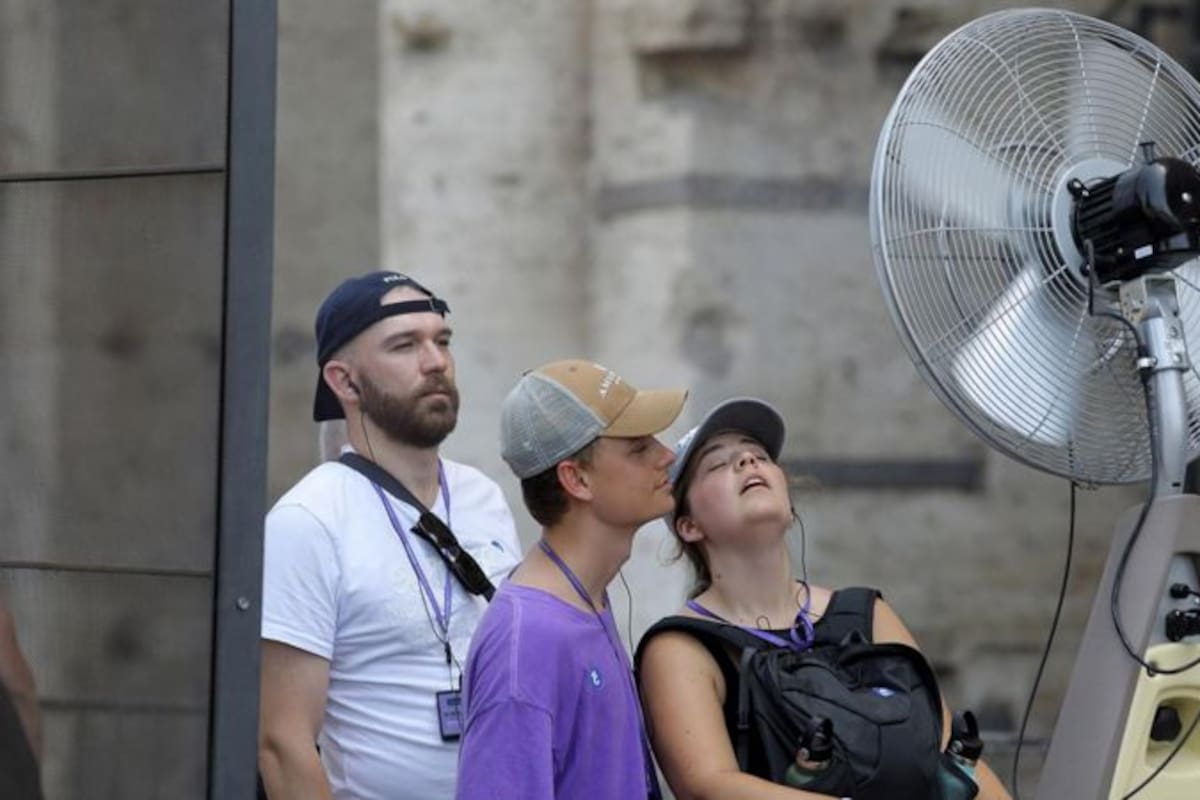 Firefighters scramble to contain fires outside Athens before winds and high temperatures return
