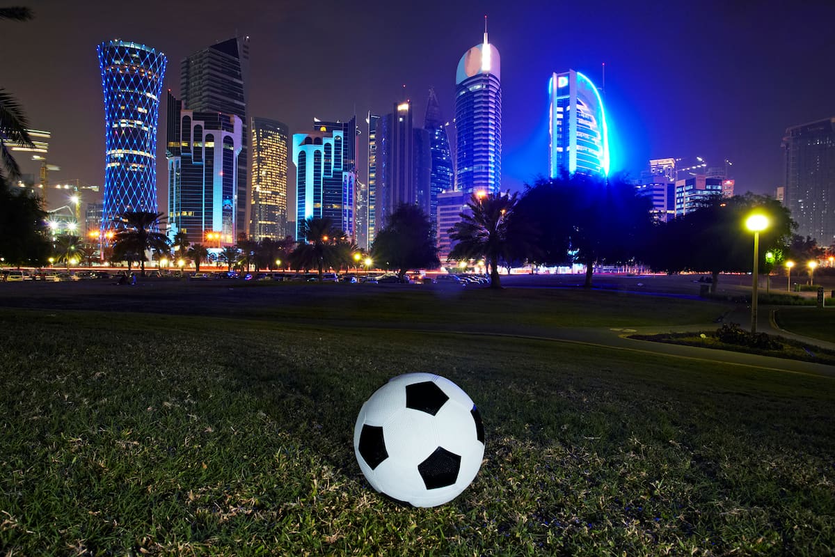 Football and skyline of the West Bay Doha. Qatar is set to stage the 2022 world cup football tournament, the first Middle east country to do so.