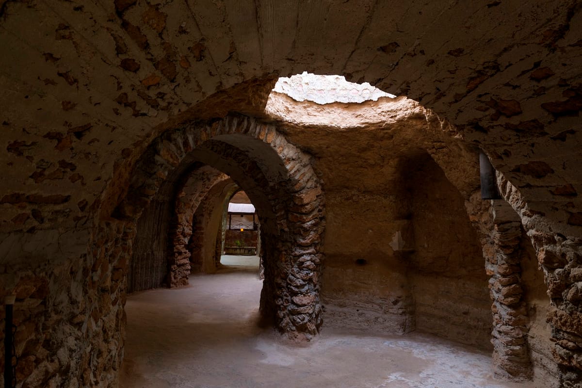 Forestiere Underground Gardens Located at 5021 West Shaw Avenue in Fresno, California are an unusual manmade creation built by Baldasare Forestiere, an immigrant from Sicily, over a period of 40 years from 1906 to until his death in 1946. It is operated by members of the Forestiere family through the Forestiere Historical Center, and can be considered a spectacular and unconventional example of vernacular architecture.
The catalyst for the construction of the underground abode was a result of the hot summers typical of the Fresno area. The inspiration lends itself to ancient Roman catacombs that Baldasare was infatuated with in his youth. Countless hours were spent excavating the hardpan layer that cements much of Fresnos soil to create his underground home. It had a summer bedroom, a winter bedroom, a bath, a functional kitchen, a fish pond, and a parlor with a fireplace.Interspersed amongst the beautiful stone walls and archways are grottoes and courtyards that allow for pockets of light. The intricate pathways were created section by section, over a span of 10 acres, without the aid of blueprints.