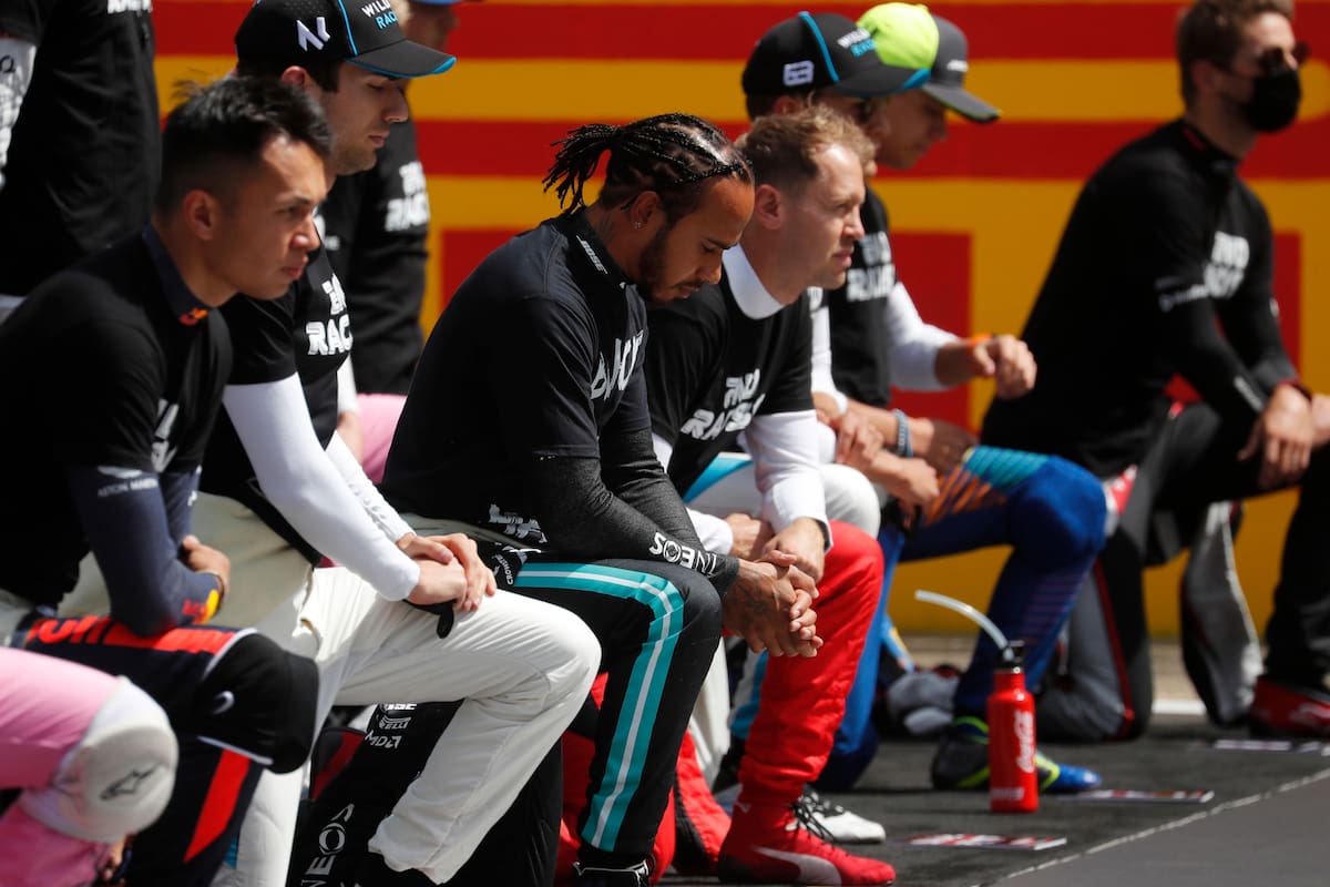 Formula One F1 - British Grand Prix - Silverstone Circuit, Silverstone, Britain - August 2, 2020 Mercedes Lewis Hamilton and drivers kneel on the grid before the race in support of the Black Lives Matte
