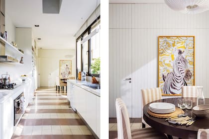 En el comedor diario, mesa circular de madera (Didot), sillas (Jazmeen Deco) tapizadas con género rayado (Agustina Lanusse), y cuadro de cebra (Paula Arocena) sobre la pared revestida con machimbre blanco.